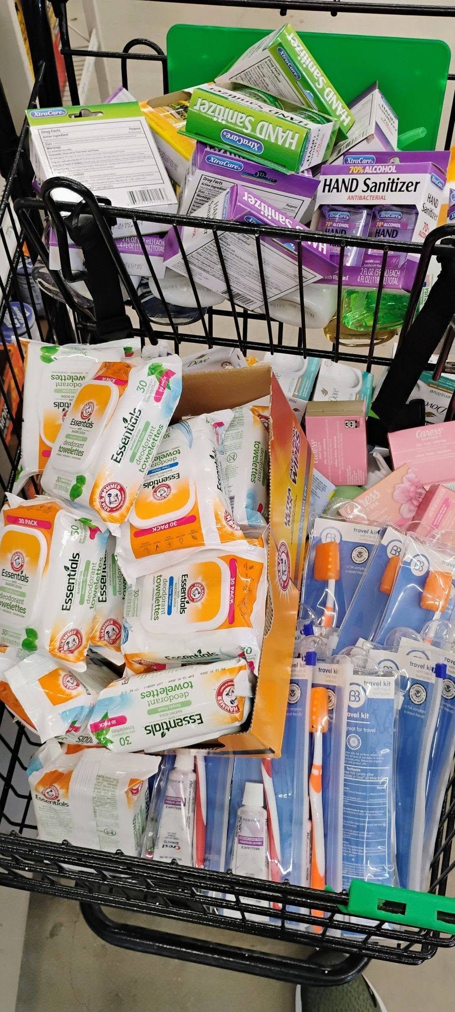 A shopping cart loaded with hand sanitizer, deodorant, toothpaste and wipes bound for a Gary, Indiana senior living facility