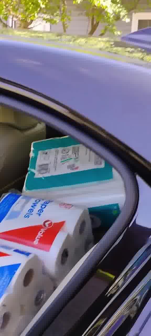 A car trunk loaded with paper towels and supplies purchased for the Gary, Indiana senior facility